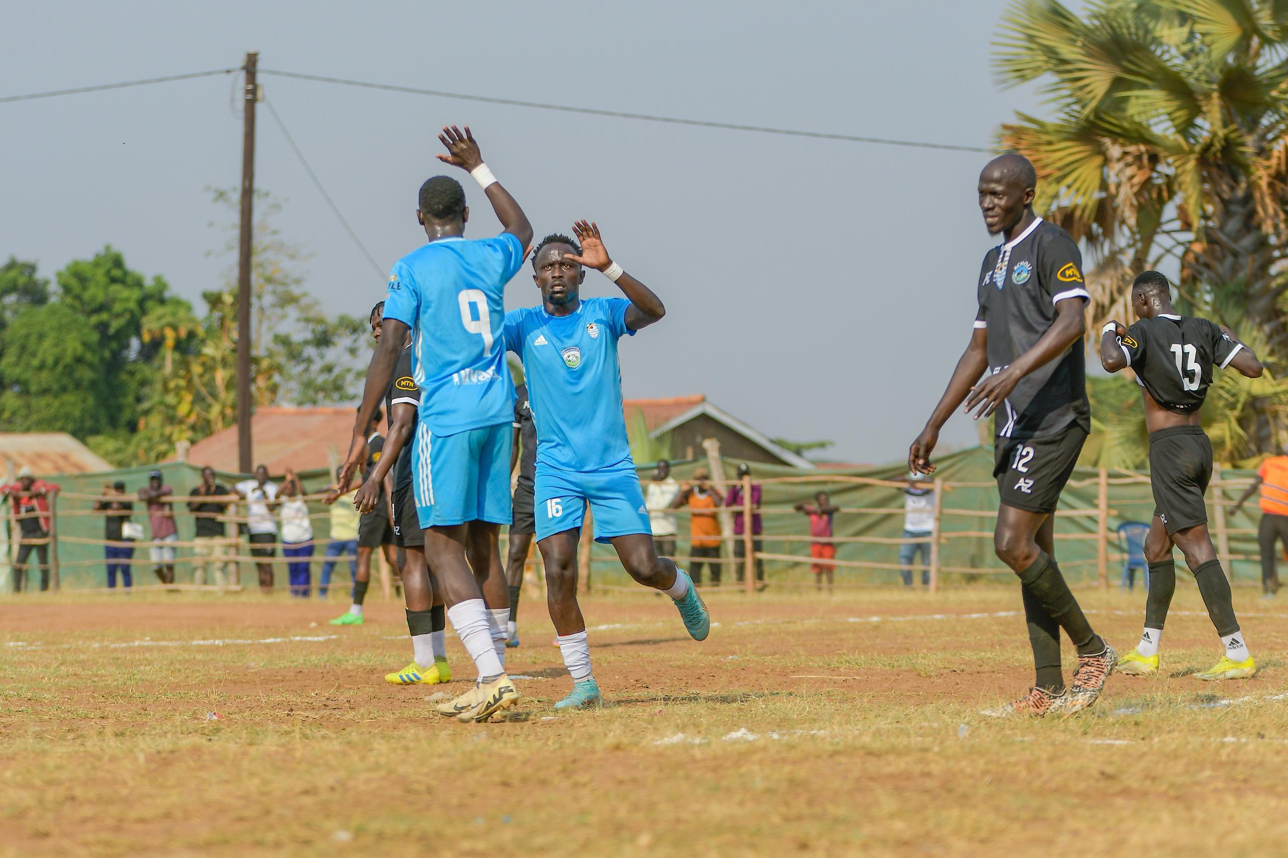 Joel Jangeyambe celebrates with Emmanuel Anyamaafter scoring first for West Nile.