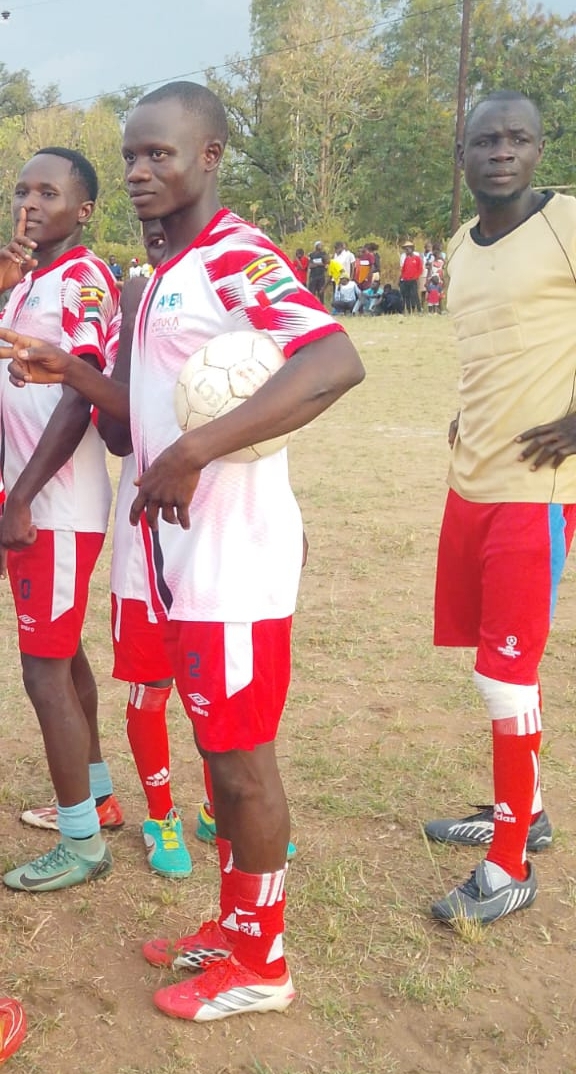 Standing behind is the late goalkeeper of uleppi soccer Academy Asiku Akbar 