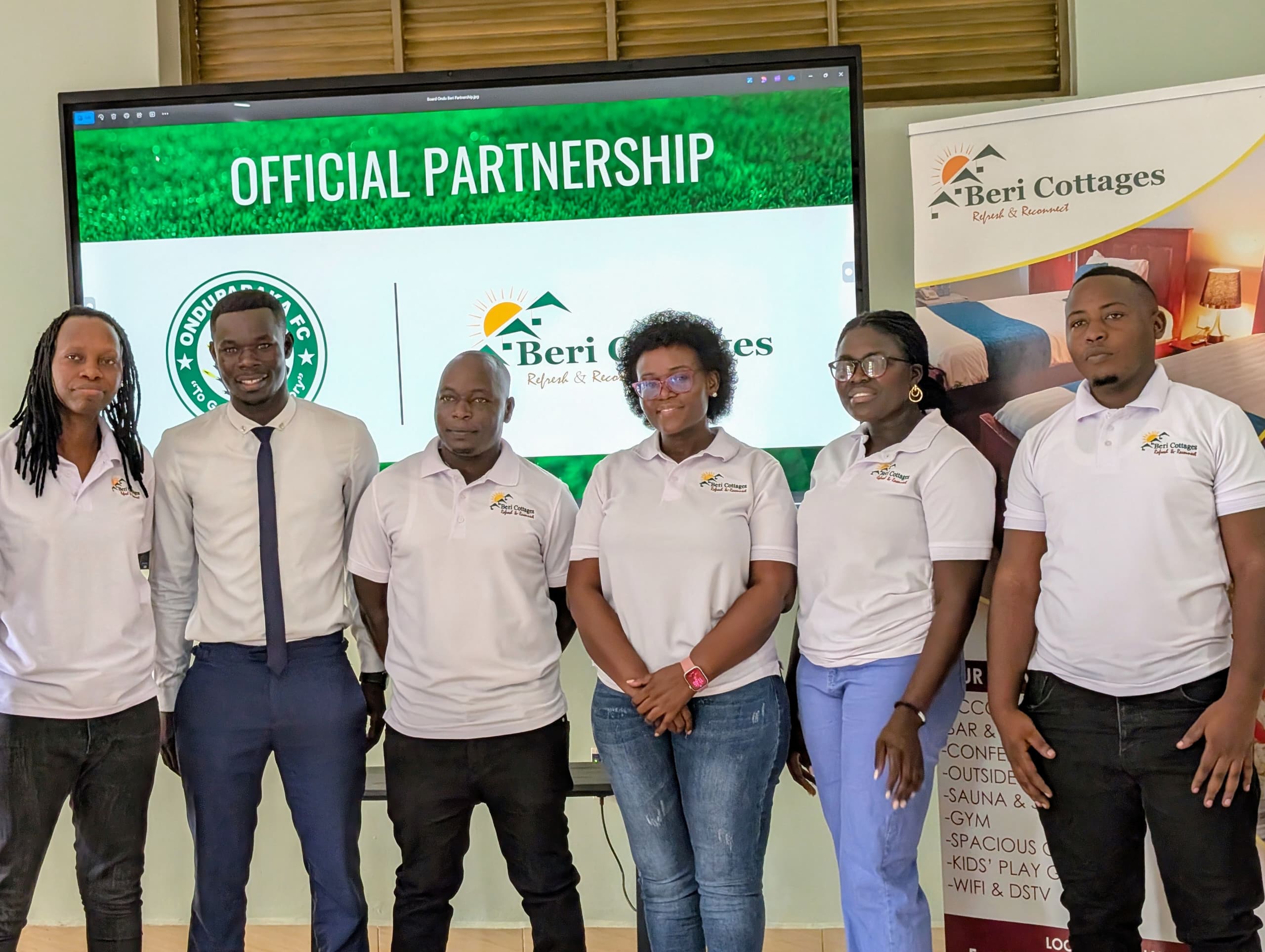 Owen Ezaga Heads of marketing and public relations Onduparaka FC in a group photo with the management of Beri cottage
