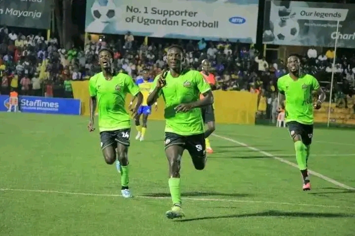 Cromwell (NEC) celebrating his goal against KCCA