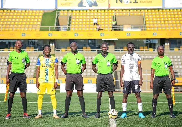 Andama Junior ( in white) captaining Calvary Fc against URA fc