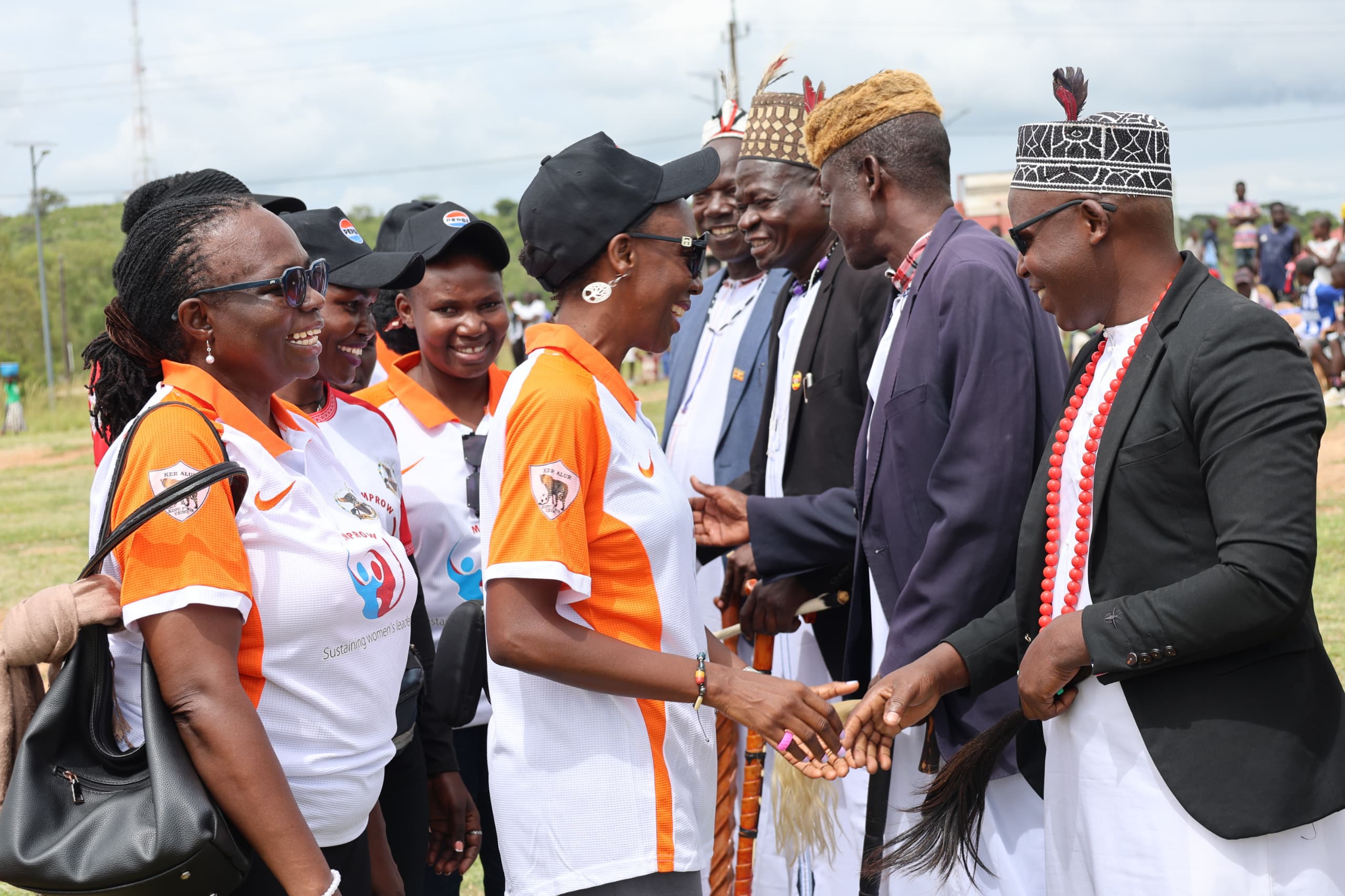 Ker Alur delegates sharing a light moment with some of the partners before kickoff