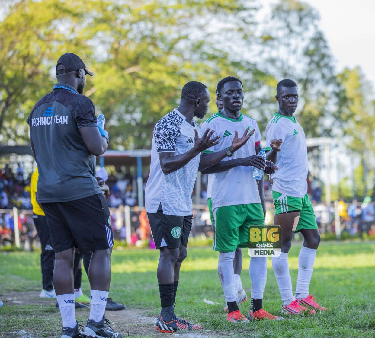Moses Abiti and Mugufeni Jonathan receiving tactical instructions from the technical team. ( Photo Credit: Big chance Media)